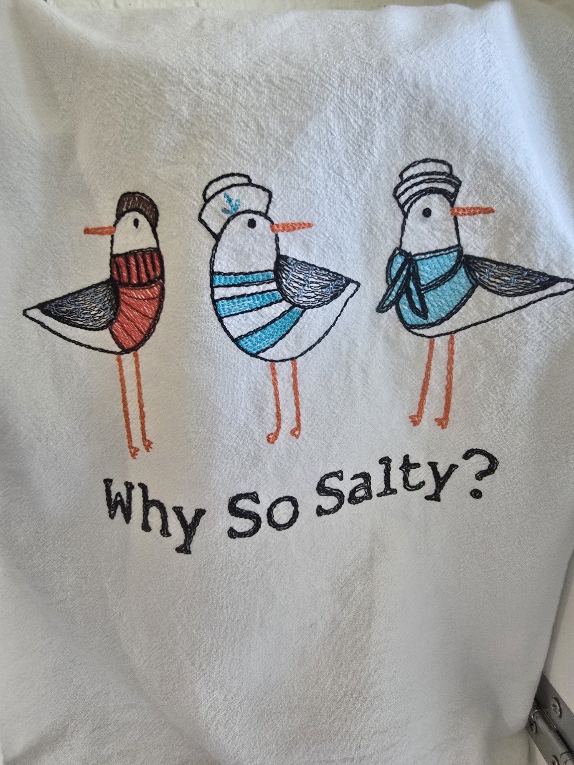Embroidered coastal humor