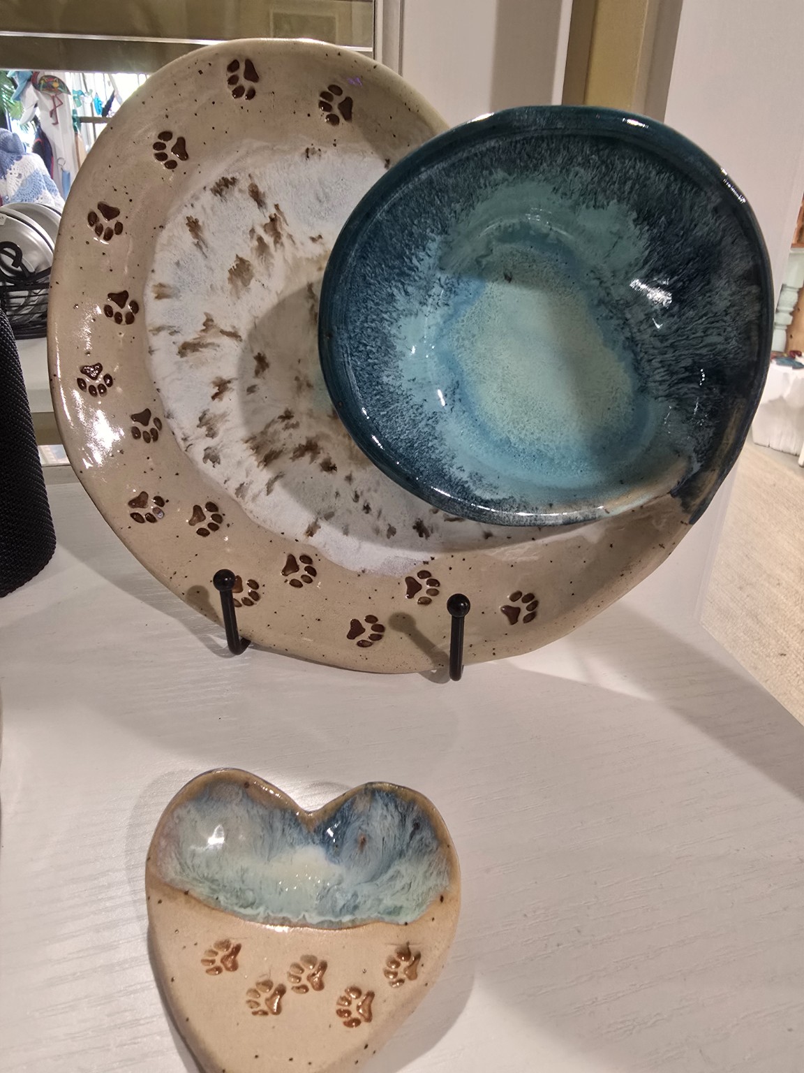 Handmade coastal pottery with paw prints